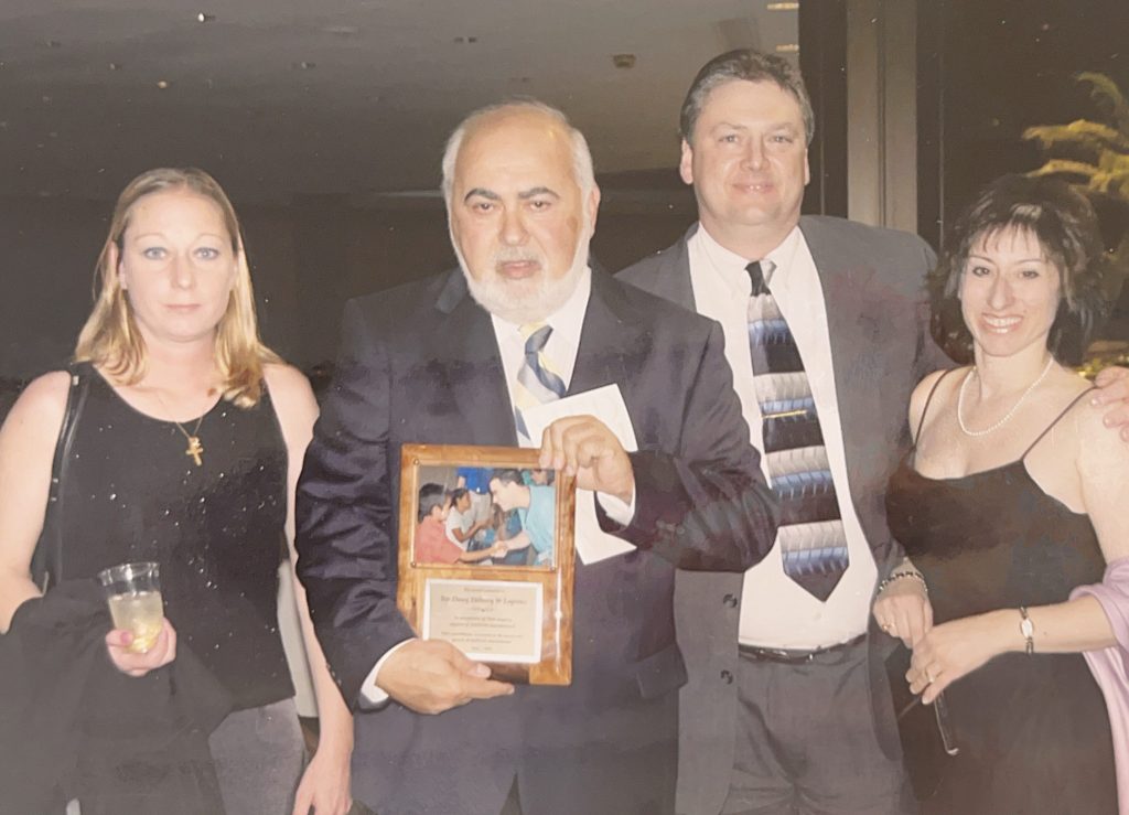 
Antoinette Koleno (left), George Sagaris (left middle), Anthony Sagaris (right middle), and Geri Sagaris (right) receive an award from MedWish for Top Dawg Group LLC's support for MedWish in 2005.